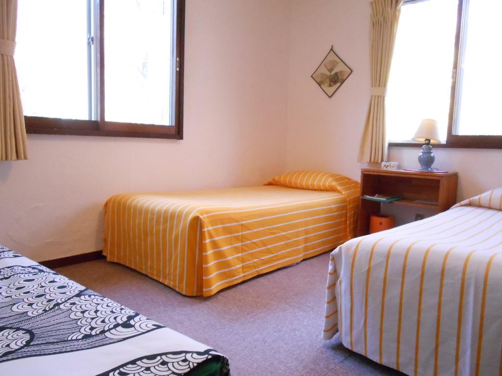 Pension Nugget Inn Хакуба Номер фото