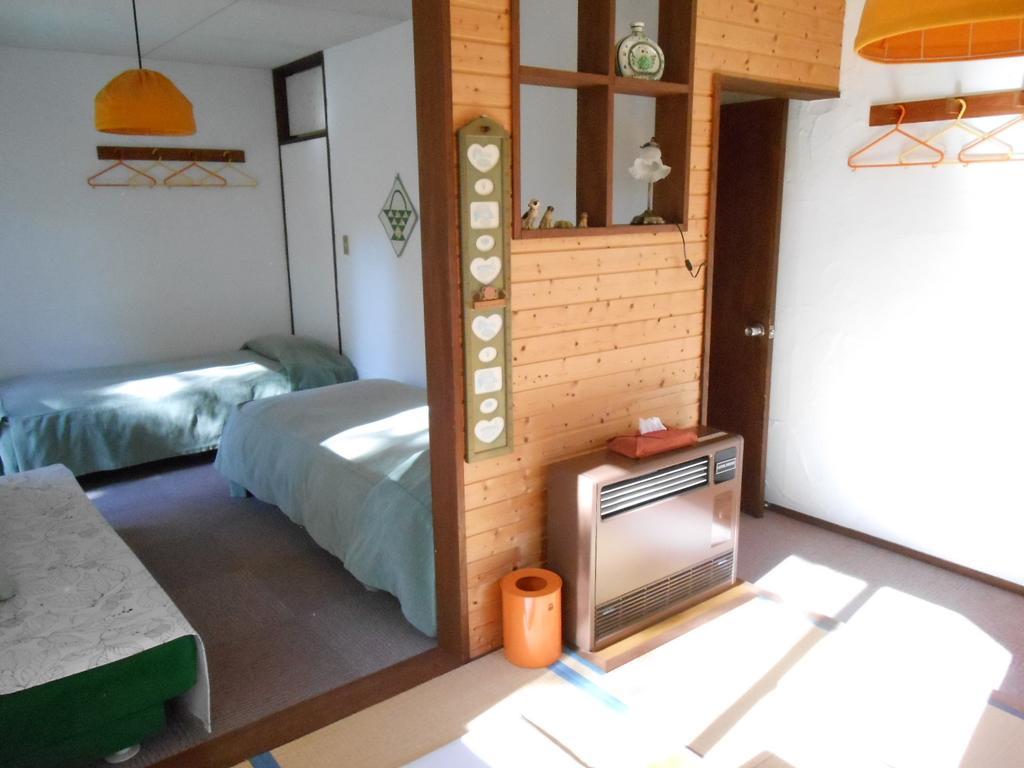 Pension Nugget Inn Хакуба Номер фото